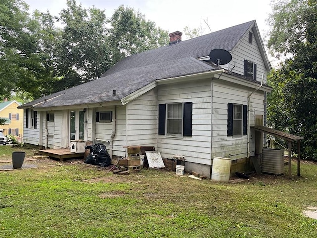 15 Liberty St, Gainesville, GA 30501 - back of house with a chimney, a lawn, and a shingled roof