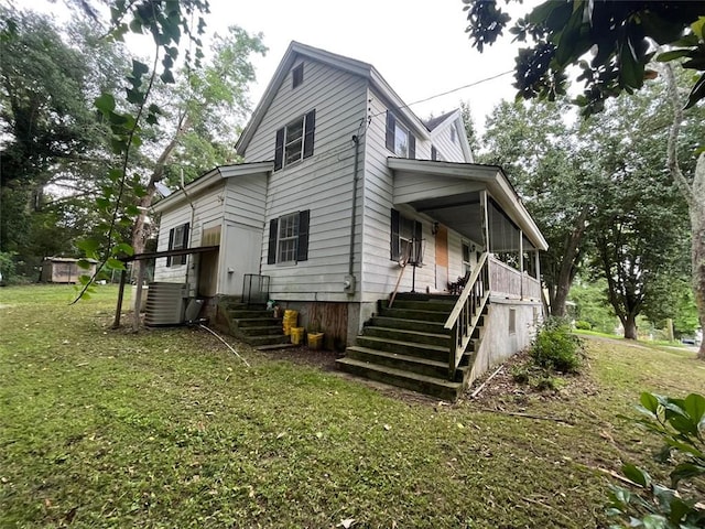 15 Liberty St, Gainesville, GA 30501 - view of side of property featuring stairway, a lawn, and a porch