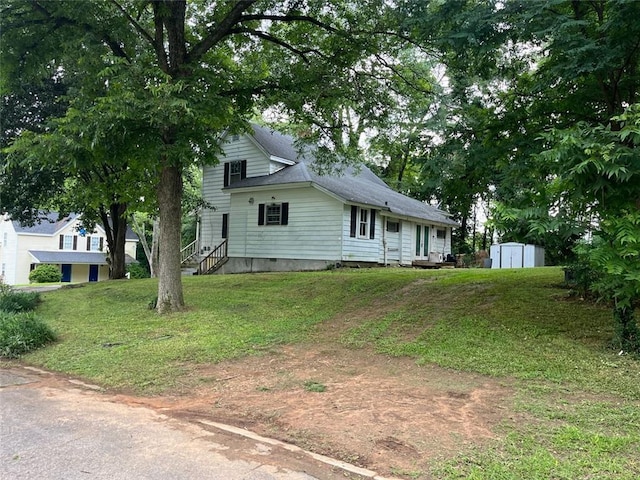 15 Liberty St, Gainesville, GA 30501 - view of front of house with a storage shed and a front lawn