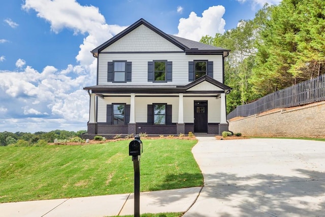 view of front of property with a front lawn and a porch