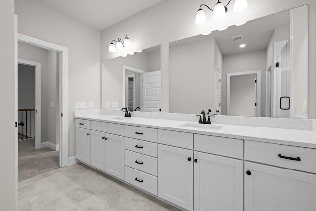 bathroom with vanity and an enclosed shower