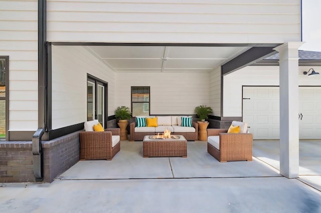 view of patio featuring a garage and an outdoor hangout area