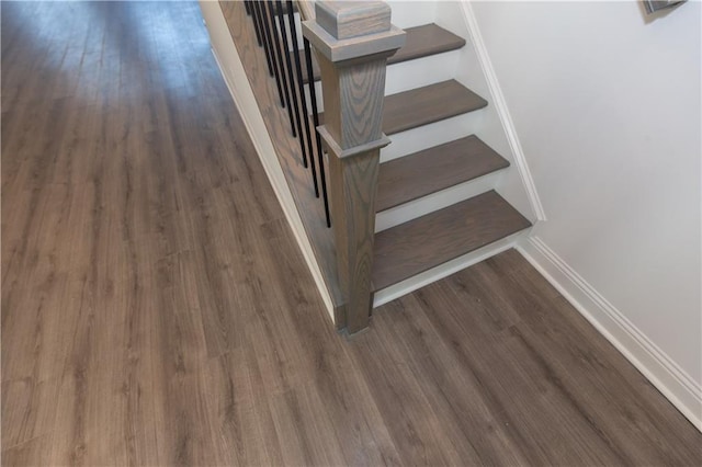 staircase featuring hardwood / wood-style floors