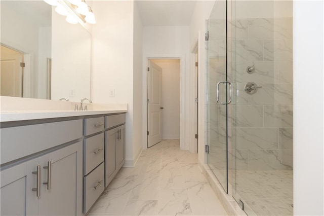 bathroom with an enclosed shower and vanity