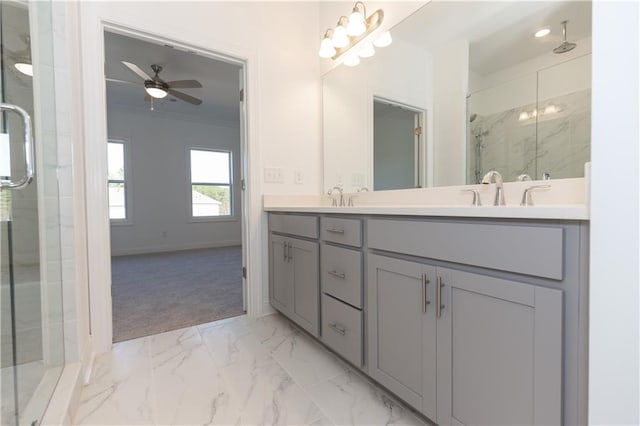 bathroom with vanity, ceiling fan, and a shower with shower door