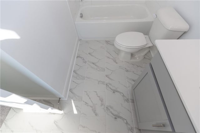 bathroom featuring a bathtub, vanity, and toilet