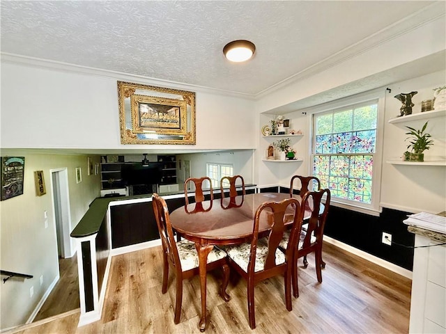 5347 Ocarol Ct, Stone Mountain, GA 30088 - dining room with light wood-type flooring, ornamental molding, plenty of natural light, and a textured ceiling