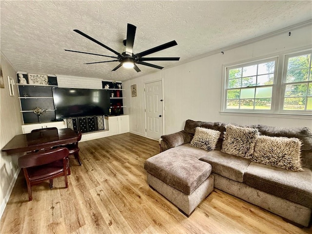 5347 Ocarol Ct, Stone Mountain, GA 30088 - living room with wood finished floors, a textured ceiling, a ceiling fan, and crown molding