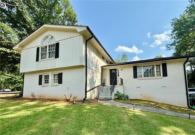 5347 Ocarol Ct, Stone Mountain, GA 30088 - split level home featuring brick siding and a front yard