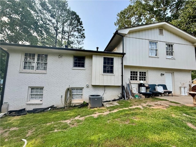 5347 Ocarol Ct, Stone Mountain, GA 30088 - rear view of property with brick siding, a yard, and a patio