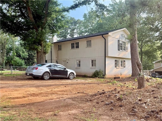 5347 Ocarol Ct, Stone Mountain, GA 30088 - view of side of property featuring brick siding and a chimney