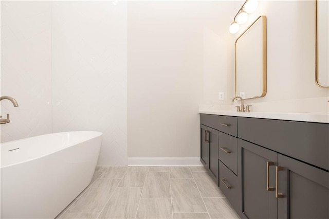 bathroom featuring vanity and a tub