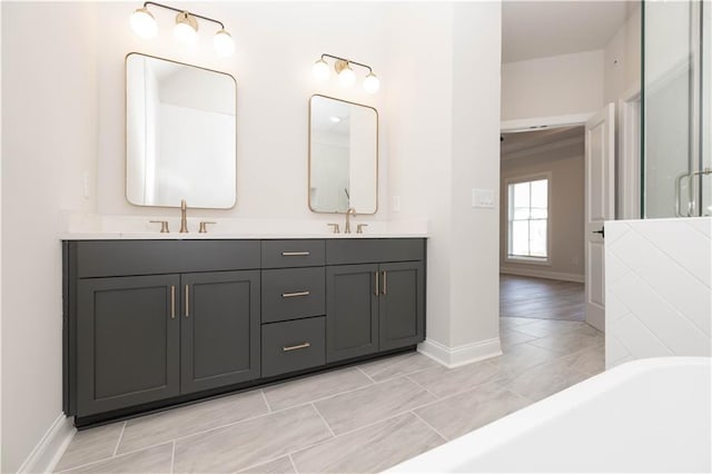 bathroom with vanity and a bathtub