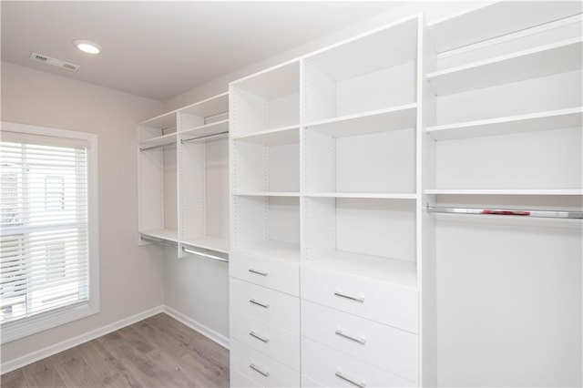 walk in closet featuring light wood-type flooring