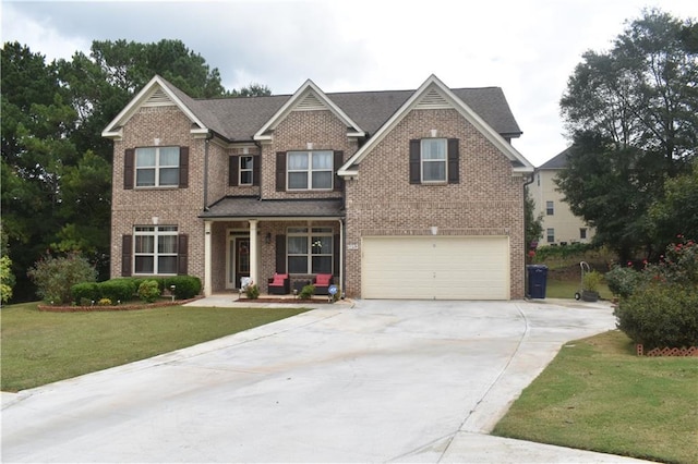 craftsman-style home with a front yard and a garage