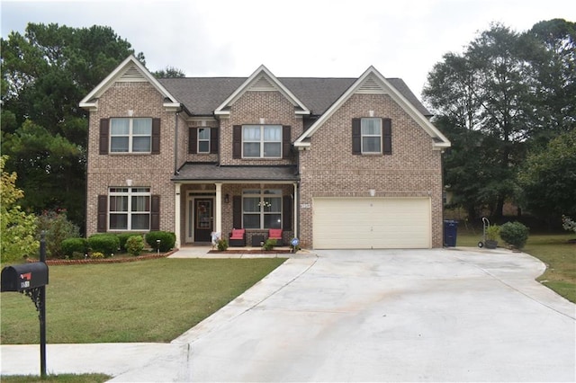 craftsman-style home featuring a garage and a front lawn