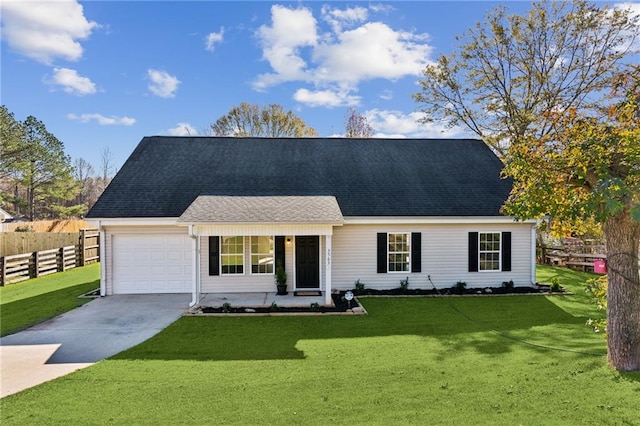 view of front facade with a front yard and a garage