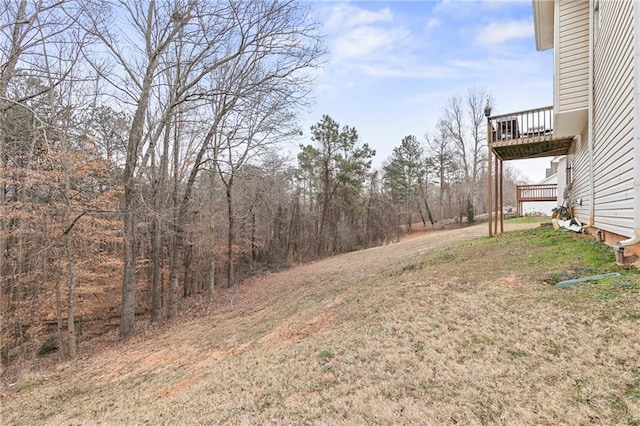 view of yard with a wooden deck