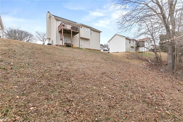 rear view of house with a balcony