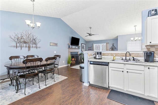 kitchen with sink, pendant lighting, dishwasher, and white cabinetry