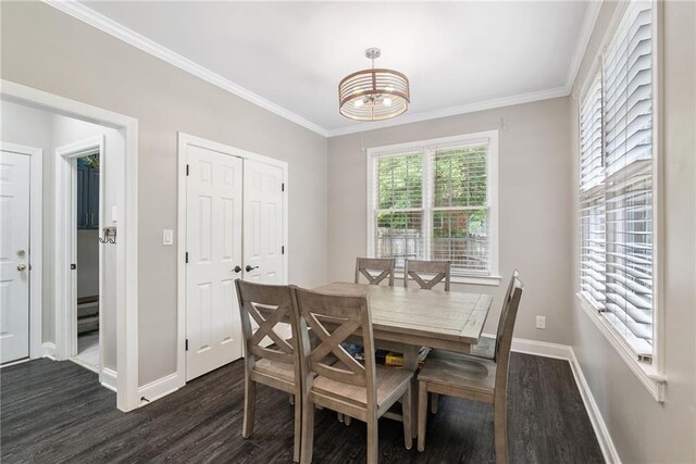 5041 Corinault Pl NW, Acworth, GA 30101 - dining room featuring dark wood-type flooring, baseboards, a chandelier, and ornamental molding