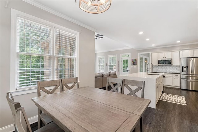 5041 Corinault Pl NW, Acworth, GA 30101 - dining area featuring dark wood finished floors, ornamental molding, healthy amount of natural light, recessed lighting, and baseboards