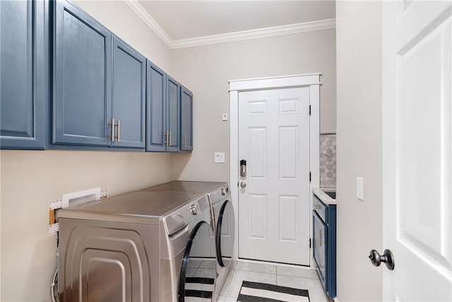 5041 Corinault Pl NW, Acworth, GA 30101 - laundry room featuring washing machine and clothes dryer, cabinet space, ornamental molding, and light tile patterned floors