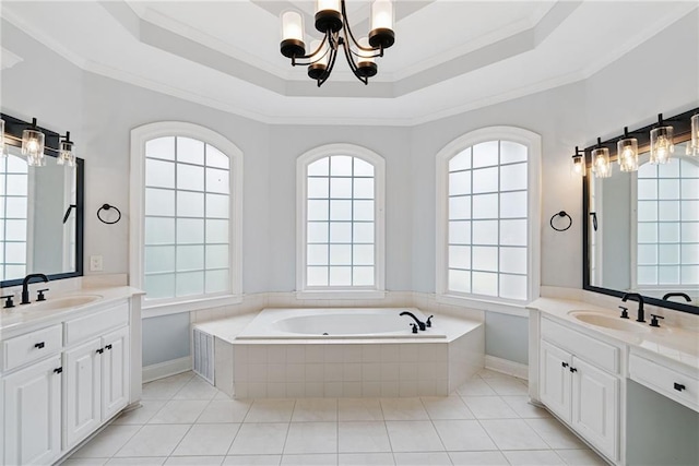 5041 Corinault Pl NW, Acworth, GA 30101 - bathroom with a chandelier, a raised ceiling, a bath, two vanities, and ornamental molding