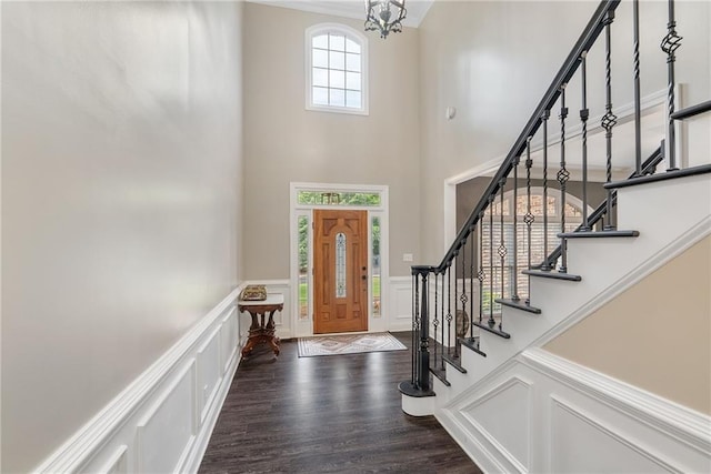 5041 Corinault Pl NW, Acworth, GA 30101 - entryway featuring a high ceiling, a decorative wall, stairs, a chandelier, and wood finished floors