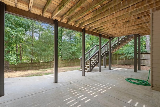 5041 Corinault Pl NW, Acworth, GA 30101 - fenced backyard with stairway, a patio, and view of wooded area