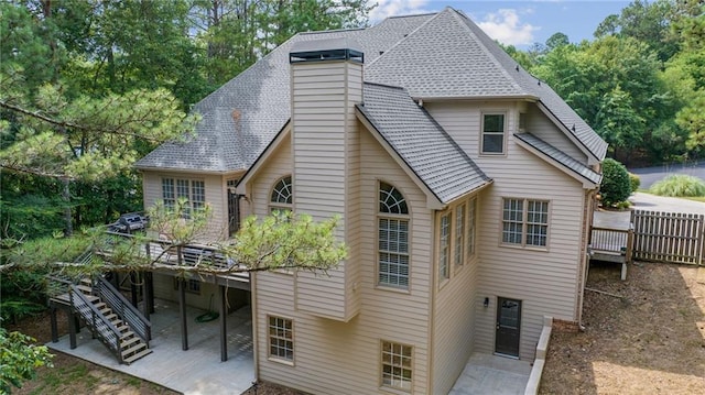 5041 Corinault Pl NW, Acworth, GA 30101 - back of house with a wooden deck, a chimney, and a patio area