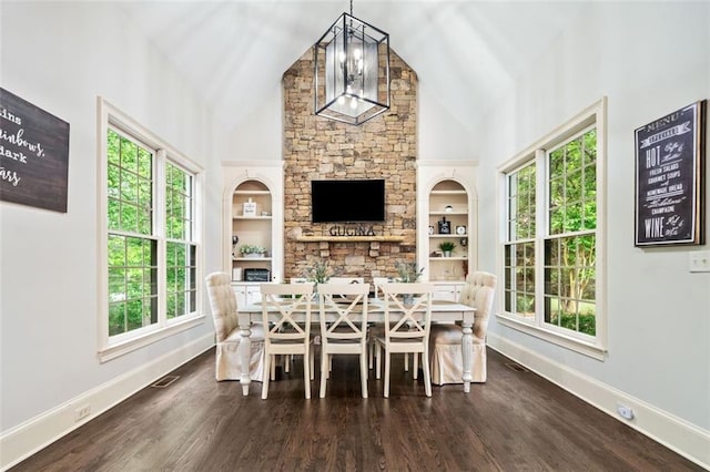 882 Hallbrook Ln, Milton, GA 30004 - dining room featuring baseboards, plenty of natural light, high vaulted ceiling, and built in shelves
