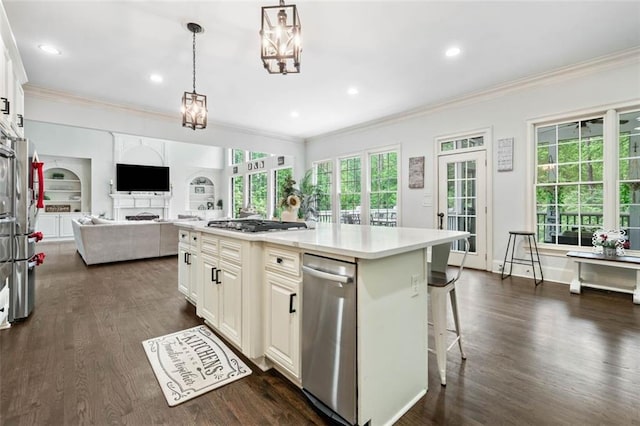 882 Hallbrook Ln, Milton, GA 30004 - kitchen featuring ornamental molding, a breakfast bar, open floor plan, light countertops, and dark wood-type flooring