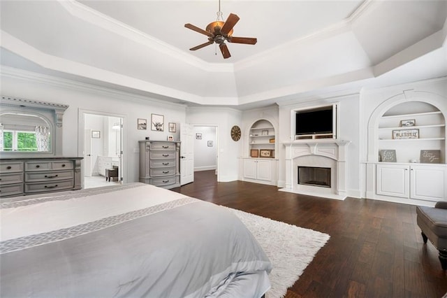 882 Hallbrook Ln, Milton, GA 30004 - bedroom featuring a tray ceiling, hardwood / wood-style flooring, a fireplace, and crown molding