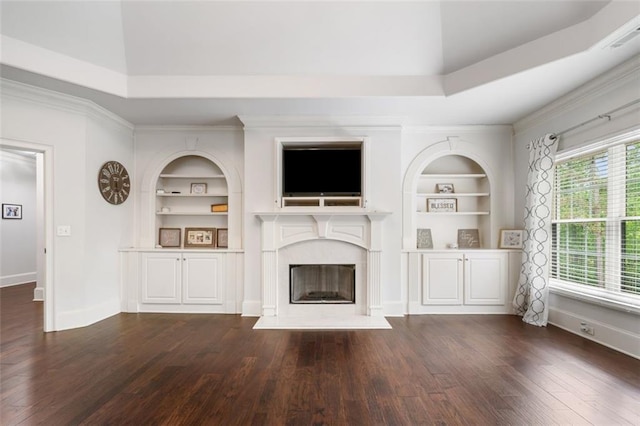 882 Hallbrook Ln, Milton, GA 30004 - unfurnished living room with built in shelves, dark wood-style floors, baseboards, crown molding, and lofted ceiling