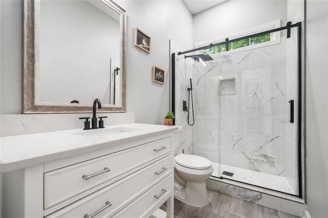 882 Hallbrook Ln, Milton, GA 30004 - full bath featuring toilet, vanity, a marble finish shower, and wood finished floors