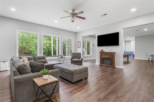 882 Hallbrook Ln, Milton, GA 30004 - living room with ceiling fan, dark wood-style floors, recessed lighting, baseboards, and a glass covered fireplace