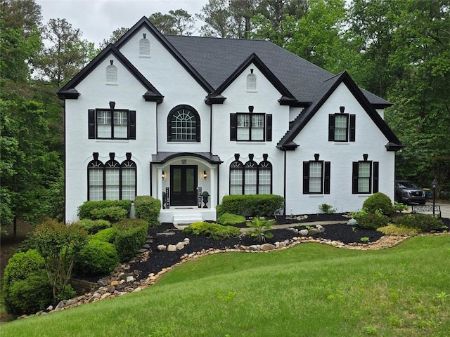 882 Hallbrook Ln, Milton, GA 30004 - french country inspired facade featuring a front lawn and french doors