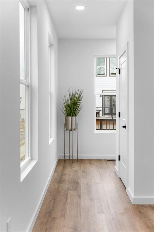 hallway featuring light hardwood / wood-style flooring