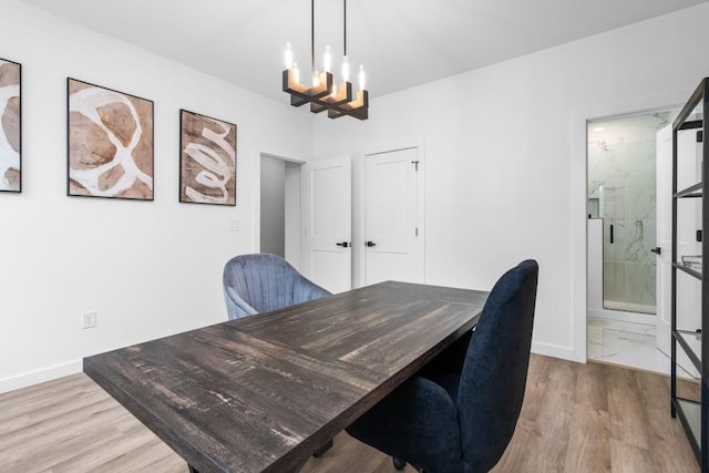 office with a chandelier and light hardwood / wood-style floors