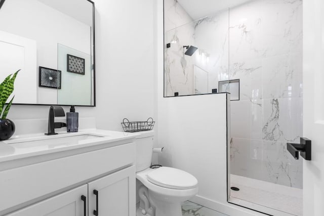 bathroom with walk in shower, vanity, and toilet