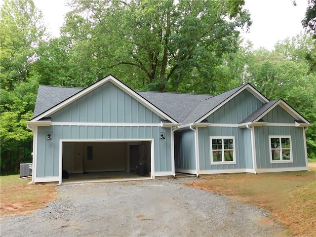 100 Elbert Gaddis Rd, Dahlonega, GA 30533 - ranch-style house with roof with shingles, driveway, a garage, and board and batten siding