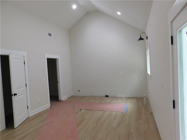 100 Elbert Gaddis Rd, Dahlonega, GA 30533 - unfurnished bedroom with light wood-type flooring, high vaulted ceiling, and recessed lighting