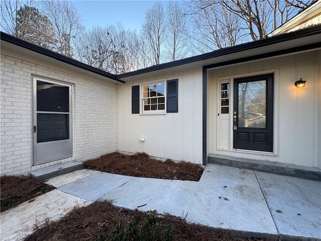 entrance to property with a patio