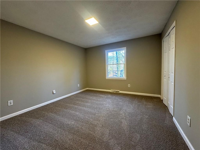 spare room with carpet flooring