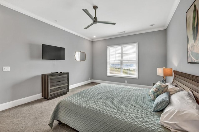 bedroom featuring crown molding, carpet, baseboards, ceiling fan, and visible vents