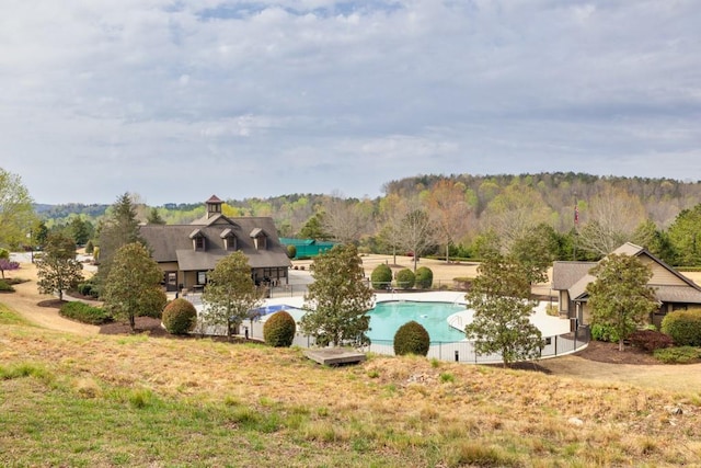 exterior space featuring a forest view