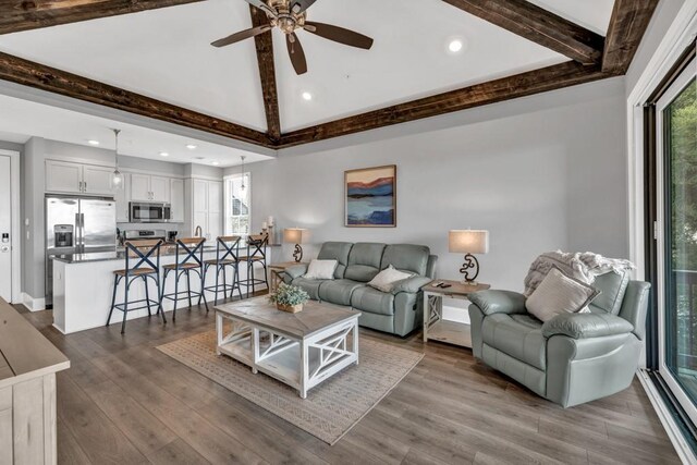 living room with recessed lighting, dark wood-type flooring, vaulted ceiling with beams, and ceiling fan