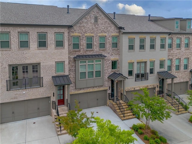 3 Hundley Ln, Roswell, GA 30076 - townhome / multi-family property with a garage, concrete driveway, brick siding, and a shingled roof