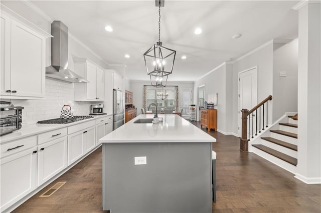 3 Hundley Ln, Roswell, GA 30076 - kitchen with wall chimney exhaust hood, a sink, stainless steel appliances, recessed lighting, and crown molding
